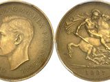 a close up of two gold coins with a man on a horse