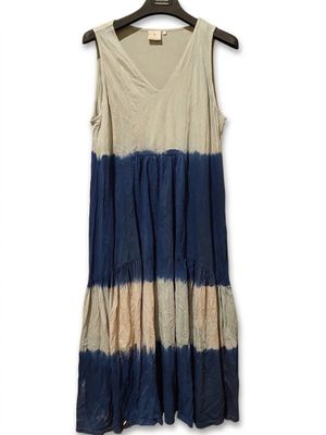 the dress is blue and beige with a white stripe