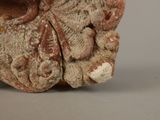 a close up of a vase on a gray surface