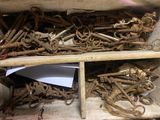 a wooden box filled with lots of old keys