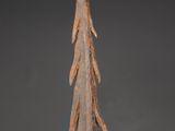 a close up of a metal sculpture of a tree on a table