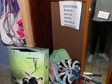 a mirror in the corner of a room with a bike and other items