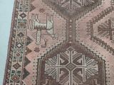 an old rug with a design on it is laying on the floor