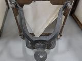 a small table with a glass top and a metal base