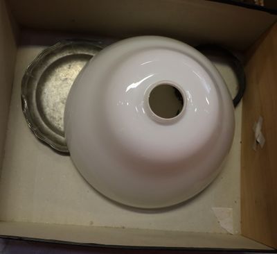 a white vase sitting in a box on a table