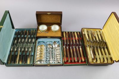 many different types of silverware in a case