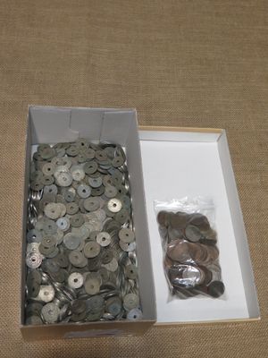 a box full of buttons and a bag of coins