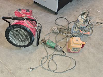 a lot of electrical equipment on the floor in the room