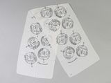 a pair of papers with drawings on them on a table