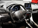 the interior of a car with a steering wheel, dashboard, and info board