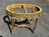 a small round table that is sitting on the pavement