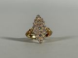 a close up of a gold ring with diamonds on it