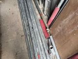 a pile of metal pipes that are sitting on the ground
