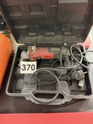 an open tool box with tools in it sitting on top of a table