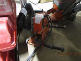 someone is using a chainsaw to cut a piece of wood