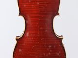 an old violin hanging from a string on a white background