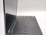 a laptop that is open on a white surface