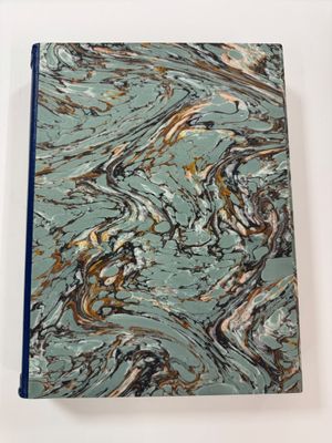 an image of a blue notebook with a marble pattern on it