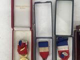a lot of medals in a case on the table