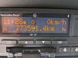 a digital clock on the dashboard of a car