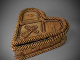 an image of a wicker heart shaped box on a gray background
