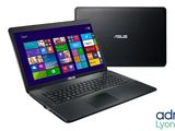 un ordinateur portable noir avec un écran Windows 8 à côté