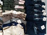many pairs of jeans that are on display in a store