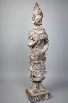 an old statue of a woman holding a baby in her arms