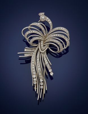 a diamond and gold broochle, by cartier