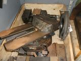 a wooden box filled with tools and a metal vise