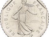 the coin has a picture of a woman carrying a basket on it