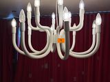 a white chandelier that is hanging from the ceiling