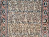 un ancien tapis persan à motif floral