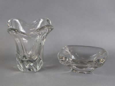 two glass vases sitting next to each other on a table