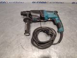 a close up of a corded drill with a cord attached to it