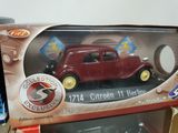 a toy car that is in a box on the table