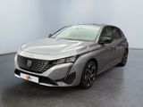 the front of a silver car in a room with a black floor