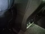 a close up of a car ' s interior with a remote control