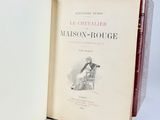 an open book with a drawing of a man sitting in a chair