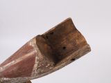 a wooden object that has been carved to look like a boat