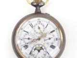 an image of a close up of a pocket watch on a white background