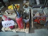 two fire extinguisors sitting on pallets next to each other