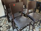 many chairs that are lined up in a room