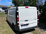 a white van that is parked on the side of the road