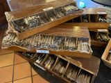 a lot of forks and spoons that are in a box