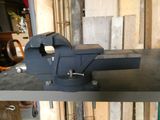 an image of a vise on a shelf in a workshop