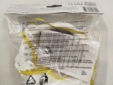 a package with a pair of scissors in it on a table