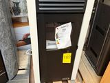 an image of a black and white refrigerator in a room