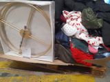 a suitcase full of clothes and a wheel on the floor