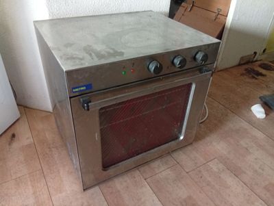 a stove that is sitting in the middle of the floor